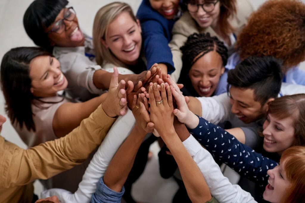 High angle shot of a large group of businesspeople sharing a high-five